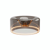 E27 LED-donutpære i røgfarvet glas, Ø 195 mm, tændt, varm lysring, hvid baggrund